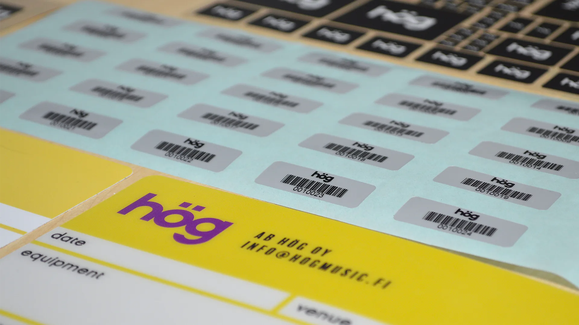 Serialised barcode asset labels and custom flight case labels manufactured by Adcal Labels for HÖG, Finland